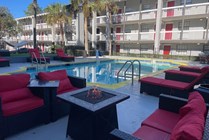 Relax and unwind in the tranquil poolside retreat, perfect for sunbathing or an evening by the fire.