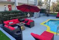 Relax in style at this chic outdoor lounge by the pool.