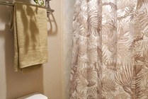 Experience tranquility in this beautifully designed bathroom with soothing decor.