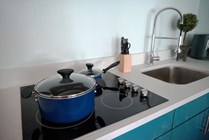 Experience culinary excellence with this stylish kitchen, featuring modern appliances and chic design.