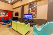 Experience the ultimate entertainment space with a pop of color and sports flair.