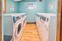 Experience convenience and efficiency in our well-equipped laundry room.